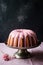 Bundt cake with milky strawberry glaze