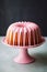 Bundt cake with milky strawberry glaze