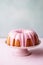 Bundt cake with milky strawberry glaze