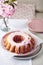 Bundt cake with pink cherry flowers