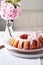 Bundt cake with pink cherry flowers
