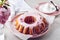 Bundt cake with pink cherry flowers