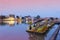 Bung Phalanchai Lake, public park and landmark of Roi Et province, northeastern Thailand, with duck pedal boats during sunset