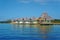 Bungalows over water with thatched roof