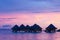 Bungalows at sunset in Bora Bora
