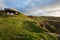Bunker in sunny grassland on rocky coast