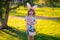 Bunny child. Child boy hunting easter eggs. Cute kid in rabbit costume with bunny ears having easter in park. Children