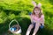 Bunny easter child. Kids hunting easter eggs. easter basket Boy with easter eggs and bunny ears in backyard.