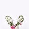 Bunny rabbit ears made of roses flowers, leaves and quail eggs. Happy easter concept, floral boho style