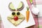 Bunny rabbit made from food with white plate and spoon