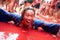 Bunol, Spain - August 28: The man lies and laughs in tomato slush on Tomatina festival in Bunol, August 28, 2013 in Spain
