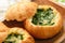 Buns baked with spinach, cheese and egg.