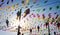 Bunting, colorful party flags, on a blue sky.