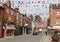 Bunting and shops, Dig St., Ashbourne, Derbyshire