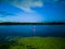 The buoy glows red and denoting the fairway at night in the middle of the river