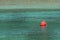 Buoy on turquoise