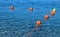 Buoys floating on a crystalline transparent sea