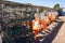 Buoys hang on a rack next to lobster traps