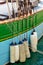 Buoys hanging outside the hull of a colorful wooden sailing boat