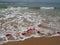 Buoys on a rope in sea water. The lifebuoys are pink restraints to alert people to the depth of the water. Rescue of the