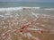 Buoys on a rope in sea water. The lifebuoys are pink restraints to alert people to the depth of the water. Rescue of the