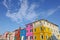 Burano island canal, small colored houses and the boats