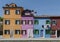 BURANO, ITALY - APRIL 18, 2009: Street with colorful buildings in Burano island, a gracious little town full of canals, near Venic