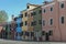 BURANO, ITALY - APRIL 18, 2009: Street with colorful buildings in Burano island, a gracious little town full of canals, near Venic