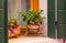 Buranoy, window with flowers on windowsill in decorative flowerpots