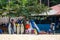 Bureh Beach, Sierra Leone - January 11, 2014: Bureh Beach surf club with colorful buildings, surf boards and trees