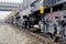 Burgas, Bulgaria - January 24, 2017. Freight cargo train - black cars wagons. New 6-axled flat wagon ,Type: Sahmmn, Model WW 6