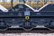 Burgas, Bulgaria - January 24, 2017 - Freight cargo train - black cars wagons - New 6-axled flat wagon - Type: Sahmmn - Model WW 6