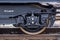Burgas, Bulgaria - January 24, 2017 - Wheel - Freight cargo train - black cars wagons - New 6-axled flat wagon - Type: Sahmmn - Mo