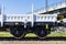 Burgas, Bulgaria - March 20, 2017 - Freight cargo train - 4axled flat wagon white Type:Rens Model:192, B - Transvagon AD