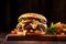 Burger with cheese, lettuce , sauce, onion and cucumber on a wooden board, black background