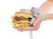 Burger cheeseburger in hands with measure tape