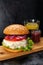 Burger with chicken cutlet, tomato sauce and mozzarella