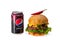 Burger with chili pepper and can of Pepsi