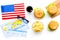 Burger, chips, map, tickets and usa flag for gastronomical tourism to America on white background top view