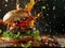 Burger with dynamic sauce splash and flying ingredients on dark background