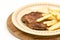 Burger with french fries served on the plate. Minced meat hamburger with potatoes isolated over white background