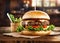 Burger with fried beef, vegetables, sauce on a rustic wooden table. Junk food concept