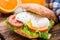 Burger with pouched egg and tomato