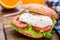 Burger with pouched egg and tomato