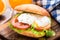 Burger with pouched egg and tomato