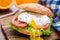 Burger with pouched egg and tomato