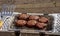 Burgers being cooked on portable BBQ