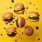 Burgers floating in the air on a yellow background