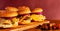 Burgers on a wooden board with potatoes. Tasty photo fast food. Place for text