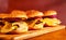 Burgers on a wooden tray with place for a headline. Stock photo